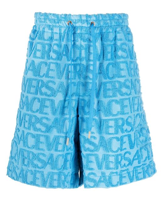 Versace Allover logo-embossed towel shorts