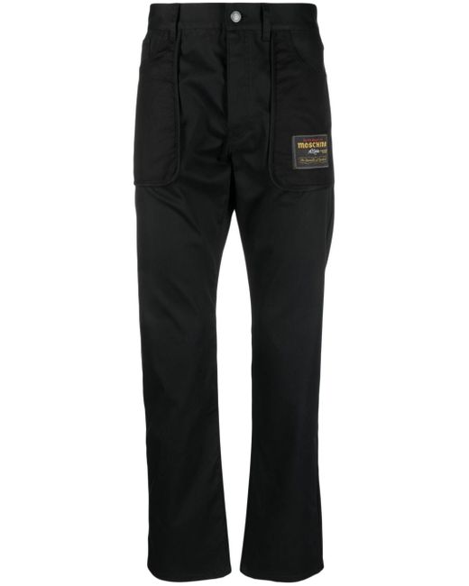 Moschino logo-patch straight-leg trousers