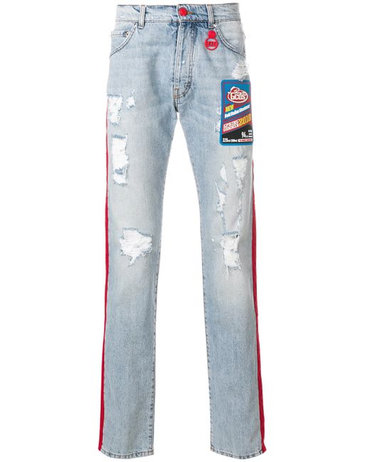 Gcds contrast side panel distressed jeans with a patch detail