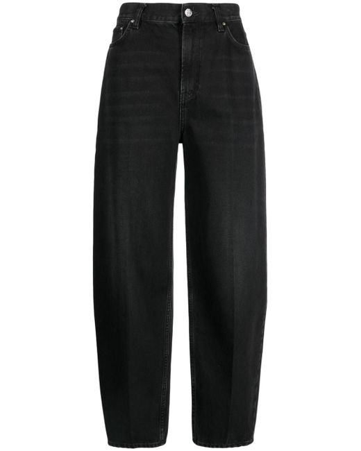 Totême faded-effect tapered-leg jeans