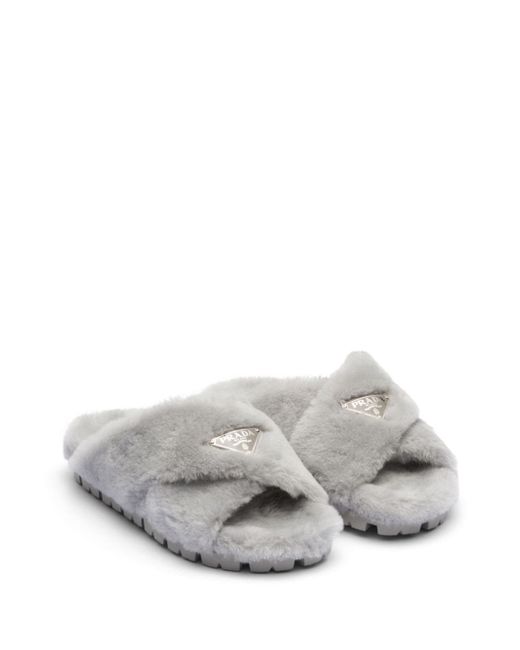 Prada triangle-logo shearling slippers