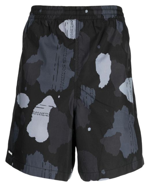 Izzue graphic-print track shorts