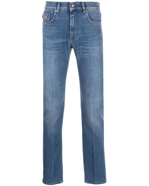 Versace logo-patch slim-cut jeans