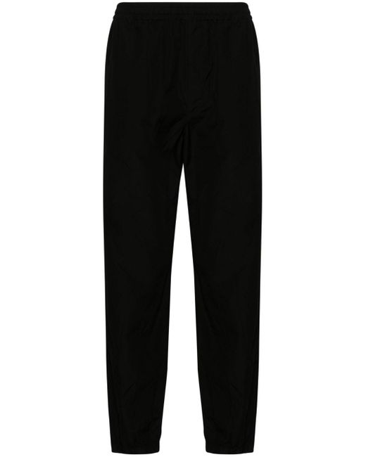 Auralee tapered-leg trousers