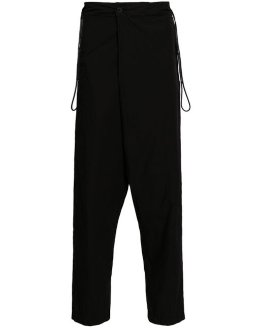 Transit off-center fastening trousers