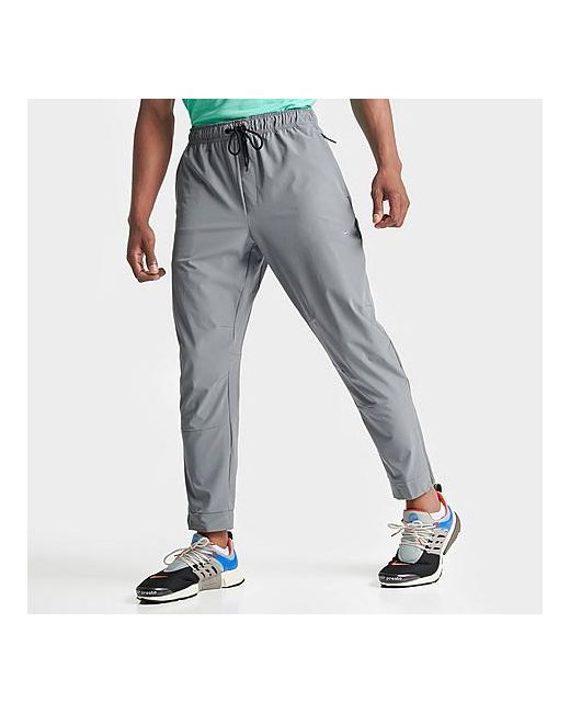 Nike Dri-FIT Unlimited Tapered Leg Versatile Training Pants in Grey/Smoke Grey Small