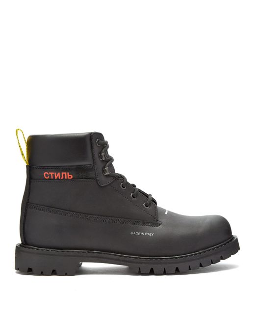 Heron Preston Logo-stamped lace-up leather boots