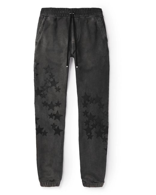 Amiri Pigment Spray Star Tapered Leather-Trimmed Cotton-Jersey Sweatpants