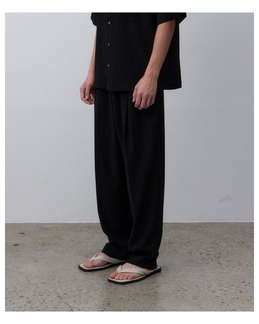 learve pleated two-tuck tapered wide trousers