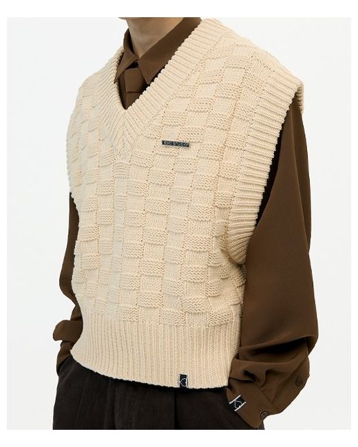 escstudio v-neck knit vest and brooch