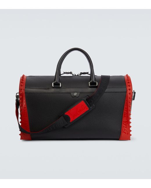 Christian Louboutin Sneakender spiked leather duffel bag