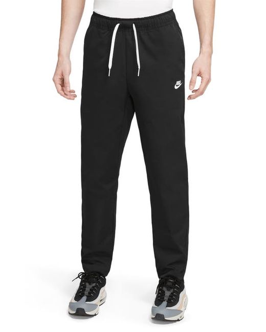 Nike Woven Tapered Leg Pants in Black at