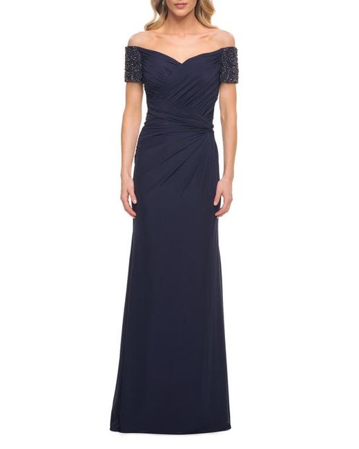 La Femme Exquisite Net Off the Shoulder Jersey Gown in at